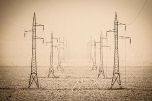 Steel high-voltage tower for power transmission in the field photo