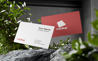 Textured Business Card Mockup Flying on Top of Rock psd