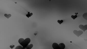 raggiante tenero bellissimo carino volante amore cuori su un' nero e bianca sfondo per San Valentino giorno video
