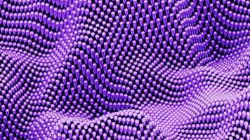 violet des balles sur une Contexte dans ondulé mouvement. conception. minimal ondulé surface avec sphères. video