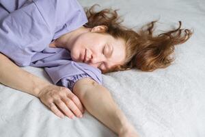 Woman Asleep in Bed photo