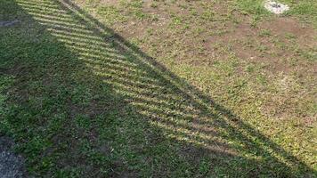 On a sunny morning, the dry yard was illuminated by the sun, then covered with clouds, and the ground was wet watered, so as not to experience drought. video