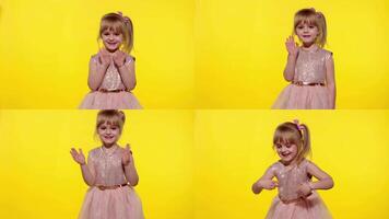 Friendly little blonde child kid girl waving to the camera doing hello or bye gesture, slow motion video
