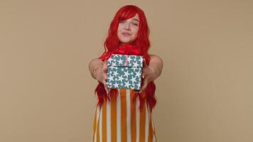 Redhead ginger girl presenting birthday gift box offer wrapped present career bonus celebrating video