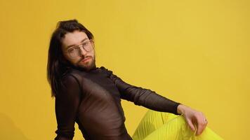 Portrait of a gay man or transgender on a yellow background. Theme of equality and freedom of choice video