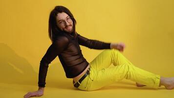 Portrait of a gay man or transgender on a yellow background. Theme of equality and freedom of choice video