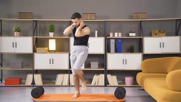 Bodybuilder man doing abs exercise at home. video