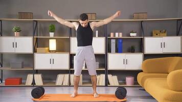 Male person training at home. video