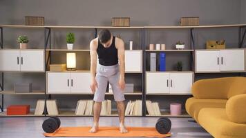 Mid adult fitness man exercising at home. video