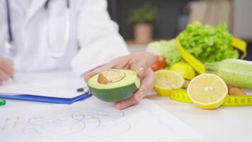 Dietician works on avocado seeds. video