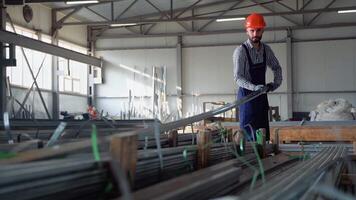Professional worker in the warehouse of metal products video