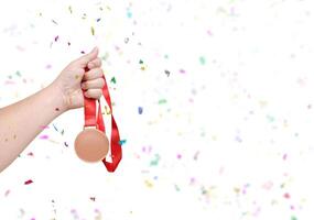 holding a bronze coin Celebrate success photo