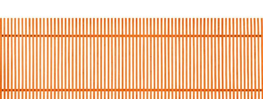 Orange vertical wooden fence on white background photo