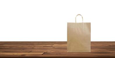 Paper bags, shopping bags on a wooden table white background photo