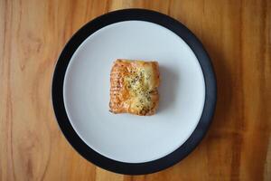 Sweet Double Cheese Bread on table photo