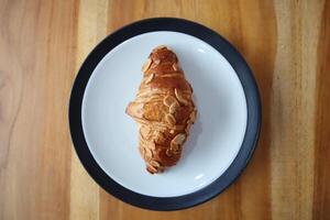 Milk Almond Croissant On table background photo