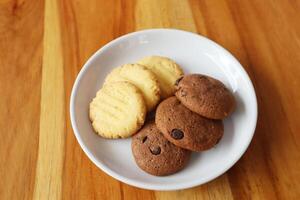 chocolate chip galleta, galleta, no gente,chocolate,bocadillo,comida,postre - dulce comida dulce comida,chocolate chip,casero,comida y beber,frescura,horneado,gourmet,listo para comer,primer plano,pila,poco saludable comiendo foto