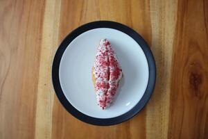 Strawberry Croissant on table background photo