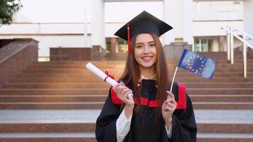 A master's graduate holds a diploma of higher education and EU flag video