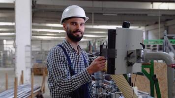 Industrial programmer checking control box status with computer video