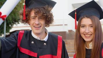 Two cheerful alumni of the unfields smile to the camera video