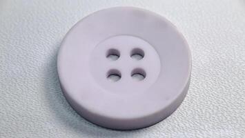 macro photo of isolated white shirt buttons