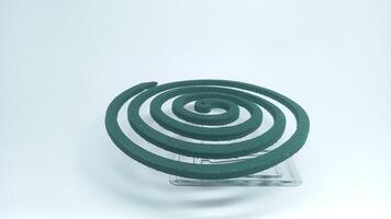 a green spiral shaped object on a clear surface photo