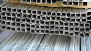 Industrial hall with metal profiles. Metal pipes made of rectangular profile in a commercial warehouse video