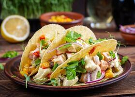 Mexican tacos with chicken meat, corn and salsa. Healthy tacos. Diet menu. Mexican taco. photo