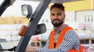 Portrait of warehouse worker wearing uniform on warehouse loader video