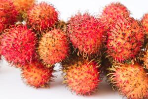 Rambutan taxonomic name, Nephelium lappaceum is a medium sized tropical tree in the Sapindaceae family photo