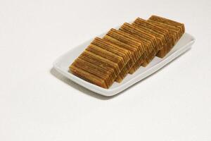 Lapis legit or traditional Indonesian sweet lapis cake on a white background photo