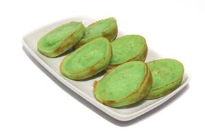 Bolu Kojo or kemojo is a typical snack from South Sumatra. Usually this cake is served at traditional events, breaking the fast, or holidays such as Eid. In general, this cake is green photo