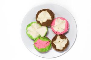 Colorful Steamed Bolu, made from wheat flour, tapioca flour, eggs and sugar. Bolu kukus is an Indonesian traditional sponge cupcake photo