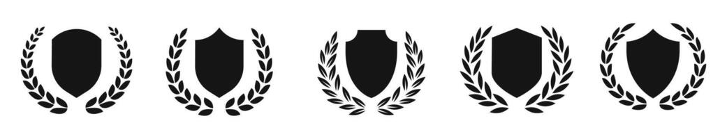 Shield with wreath silhouettes. Protection symbols. Shield icons. Laurel wreath and shields. vector