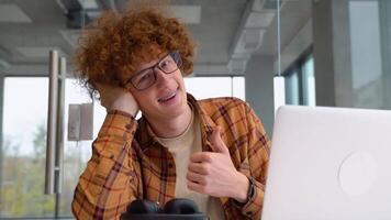 Portrait of male freelancer during break from web working online, hipster blogger sitting in cafe with laptop computer video