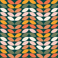 Multicolored leaves or grains on a black background forming a cute seamless pattern. vector
