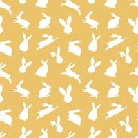 Easter seamless pattern of white rabbit silhouettes in different actions. Festive Easter bunnies design. Isolated on yellow background. For Easter decoration, wrapping paper, greeting, textile, print vector