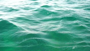 Sea water surface. Camera flies over the calm azure sea. Nobody. Holiday recreation concept. Abstract nautical summer ocean nature. Weather and climate change. Slow motion. Close up video