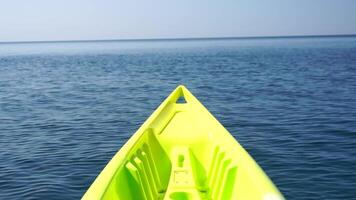 Sea water surface. Low angle view from kayak, camera flies over the clear green sea water. Nobody. Holiday recreation concept. Abstract nautical summer ocean nature. Slow motion. Close up. video