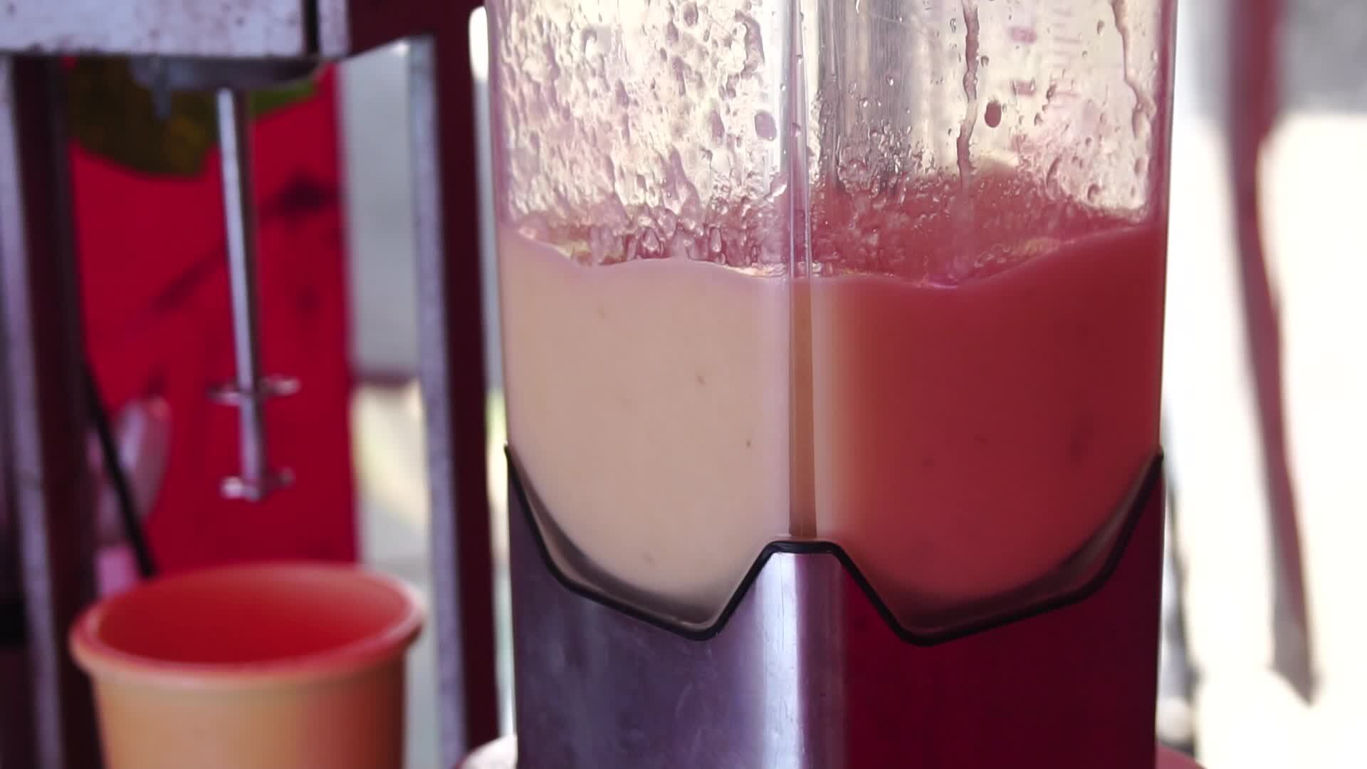 making a fruit cocktail in a blender, smoothies preparation with melon