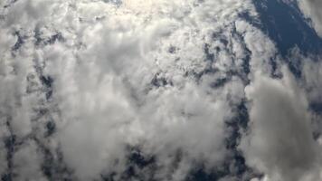 Timelapse fluffy Cumulus clouds moving in bright sunset. Abstract aerial nature summer ocean sunset, sea and sky view. Vacation, travel, holiday concept. Weather and Climate Change video