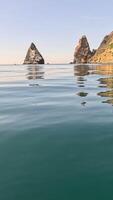 Sea water surface. Low angle view from kayak, camera flies over clear calm sea water. Nobody. Holiday recreation concept. Abstract nautical summer ocean nature. Slow motion. Close up. Vertical video