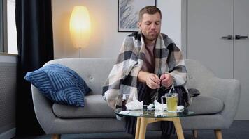 A sick man drinks a cold pill - home treatment video