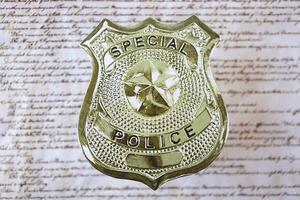 KYIV, UKRAINE - MARCH 9, 2024 US Special Police badge on United States Constitution photo