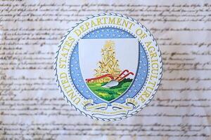 KYIV, UKRAINE - MARCH 9, 2024 US Department of Agriculture seal on United States Constitution photo