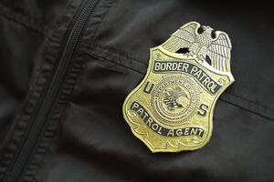 KYIV, UKRAINE - MARCH 9, 2024 US Border Patrol Agent badge on black jacket uniform photo