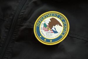 KYIV, UKRAINE - MARCH 9, 2024 US Department of Justice seal on black jacket uniform photo