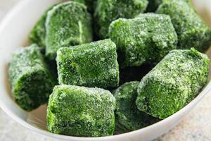 spinach frozen portion cube semifinished fresh tasty healthy eating cooking meal snack on the table copy space food background photo