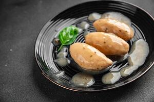 quenelles pork sauce mushroom food on a plate eating cooking appetizer meal food snack on the table copy space food background photo